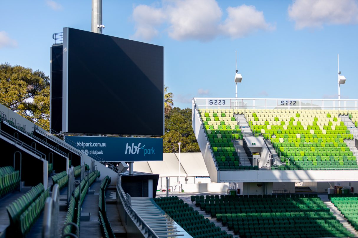 A photo taken of the large viewing screen in the corner of the HBF Park field